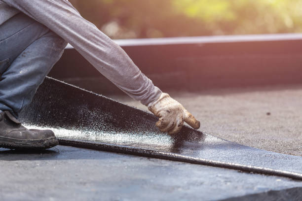 Professional Basement Waterproofing technician working in Hampton, IL